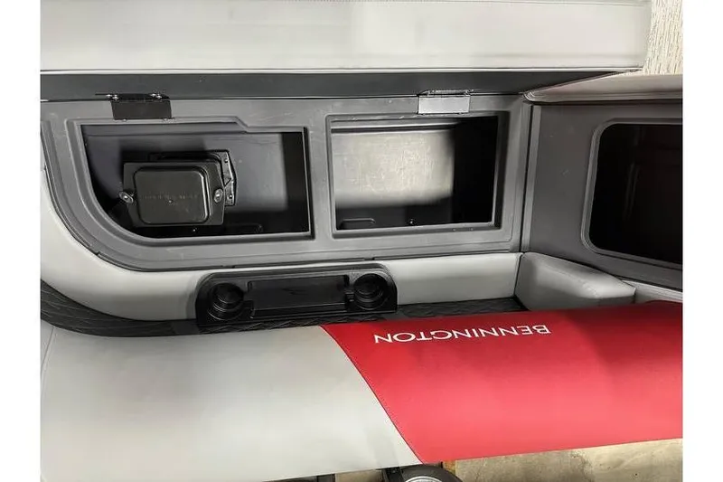Slide: The Image of Interior of 2026 Bennington 22 SSR Quad Bench, featuring storage compartments and red seating. - 19