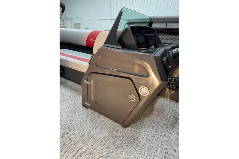 Slide: The Image of 2026 Bennington 22 SSR Quad Bench boat interior with helm and seating. - 21