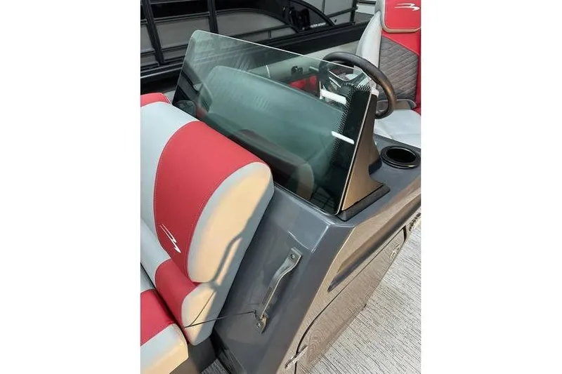 Slide: The Image of 2026 Bennington 22 SSR Quad Bench boat interior with red and gray seating. - 24