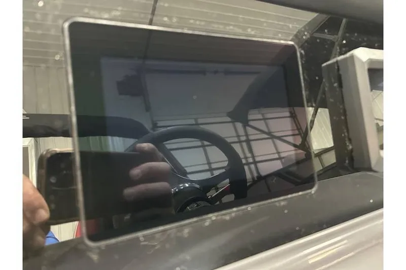 Slide: The Image of Close-up of a touchscreen display in a 2026 Bennington 22 SSR Quad Bench boat. - 29