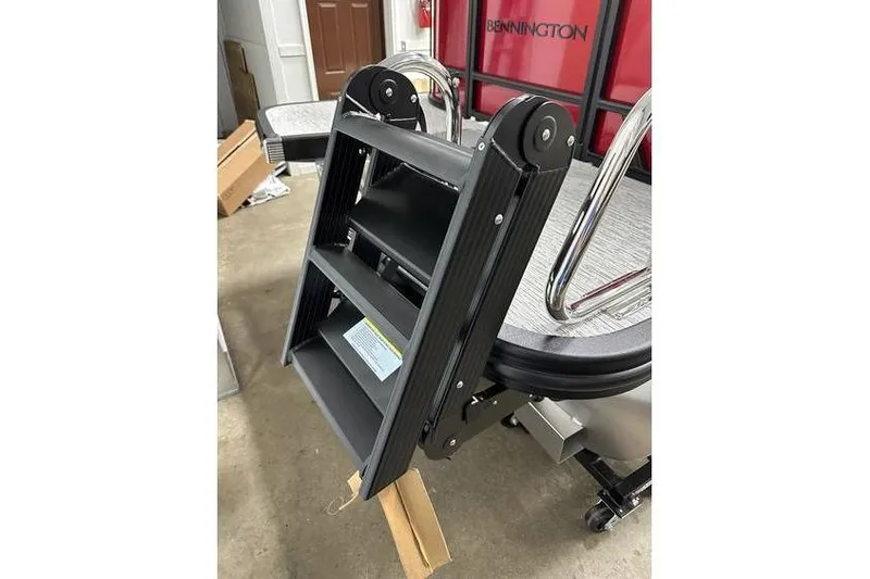 Slide: The Image of Bennington 22 SSR Quad Bench 2026 boat ladder detail in stock. - 32