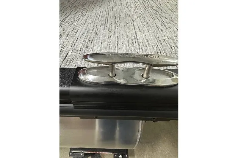 Slide: The Image of 2026 Bennington 22 SSR Quad Bench boat cleat on textured deck surface. - 35