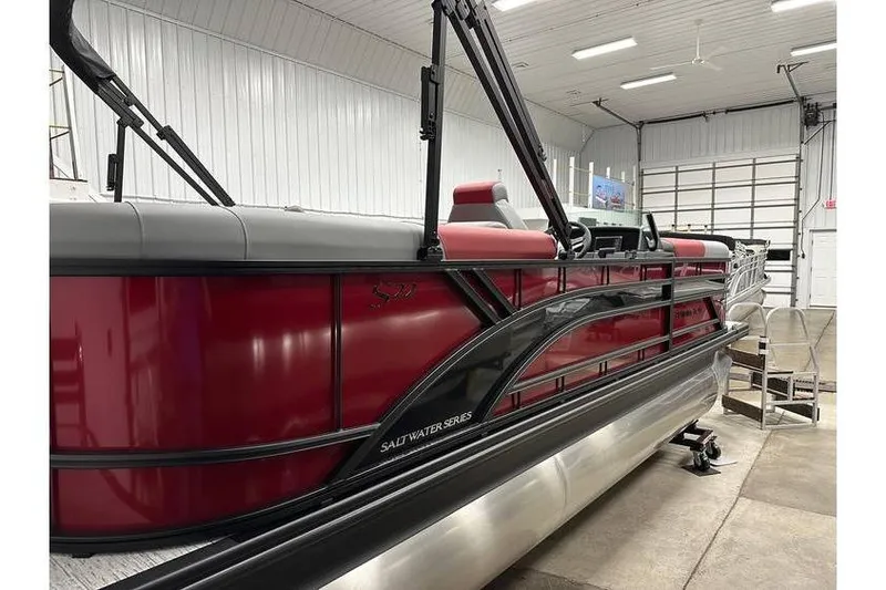 Slide: The Image of 2026 Bennington 22 SSR Quad Bench pontoon boat in a showroom setting. - 37