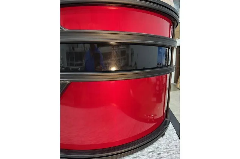 Slide: The Image of 2026 Bennington 22 SSR Quad Bench pontoon, red and black exterior detail. - 4