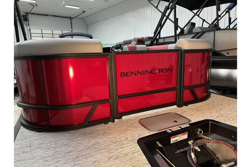 Slide: The Image of 2026 Bennington 22 SSR Quad Bench pontoon boat in stock, featuring sleek red design. - 7