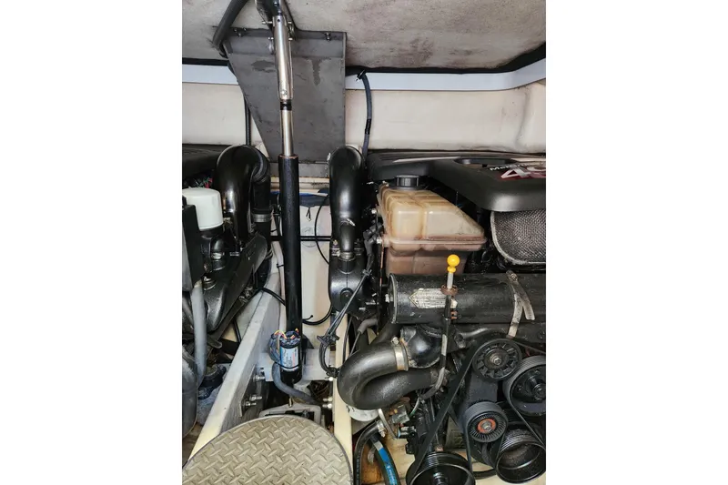 Slide: The Image of Engine compartment of a 2004 Formula 37 Performance Cruiser, showcasing mechanical components. - 8