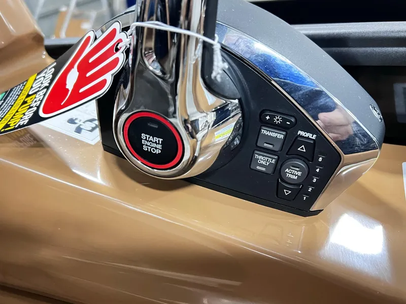 Slide: The Image of Close-up of 2024 Harris 250 Grand Mariner V10 400 engine controls with start button. - 11