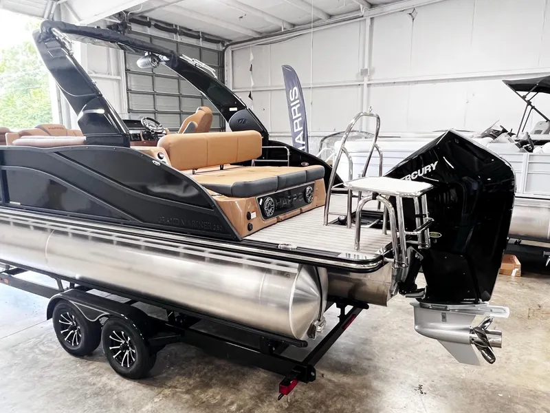 Slide: The Image of 2024 Harris 250 Grand Mariner V10 400 pontoon boat in showroom. - 23