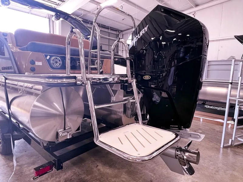 Slide: The Image of 2024 Harris 250 Grand Mariner V10 400 boat with Mercury engine in showroom. - 24