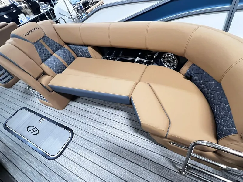 Slide: The Image of Luxurious seating on 2024 Harris 250 Grand Mariner V10 400 boat, featuring tan and gray upholstery. - 31