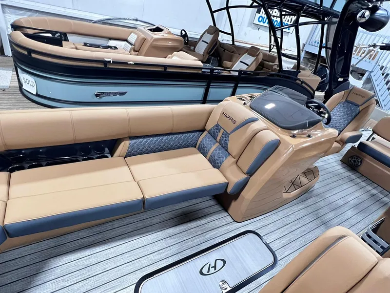 Slide: The Image of 2024 Harris 250 Grand Mariner V10 400 luxury pontoon boat interior with tan seating. - 32