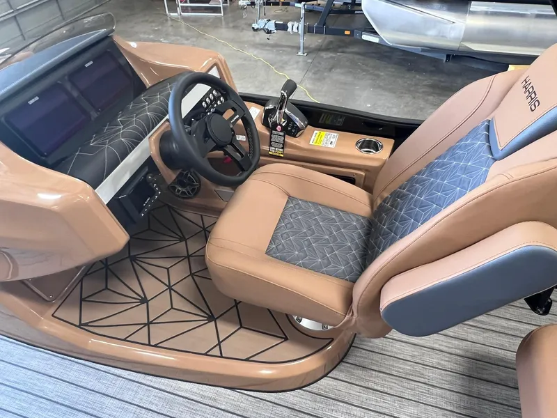 Slide: The Image of 2024 Harris 250 Grand Mariner V10 400 boat interior with luxury seating and modern dashboard. - 9