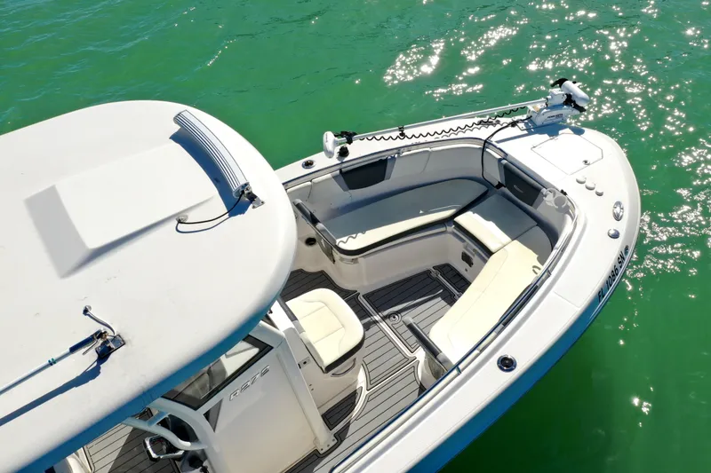 Slide: The Image of 2020 Robalo R272 Center Console boat on clear green water, aerial view. - 11
