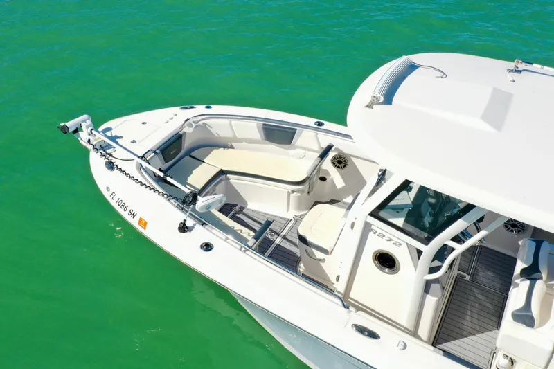 Slide: The Image of 2020 Robalo R272 Center Console boat on clear turquoise water. - 12