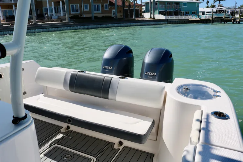 Slide: The Image of 2020 Robalo R272 Center Console boat with twin engines on calm water. - 23