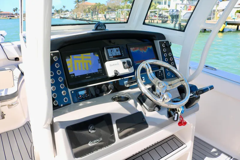 Slide: The Image of 2020 Robalo R272 Center Console boat dashboard with Garmin navigation system. - 24