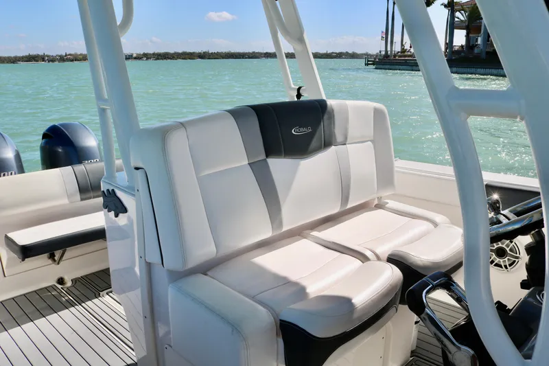 Slide: The Image of 2020 Robalo R272 Center Console boat interior with seating and ocean view. - 28