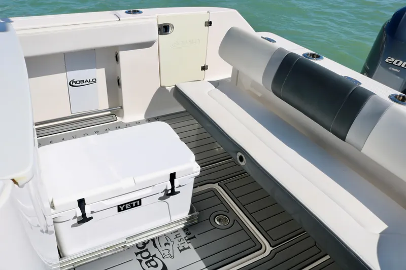 Slide: The Image of 2020 Robalo R272 Center Console boat interior with Yeti cooler and seating. - 31