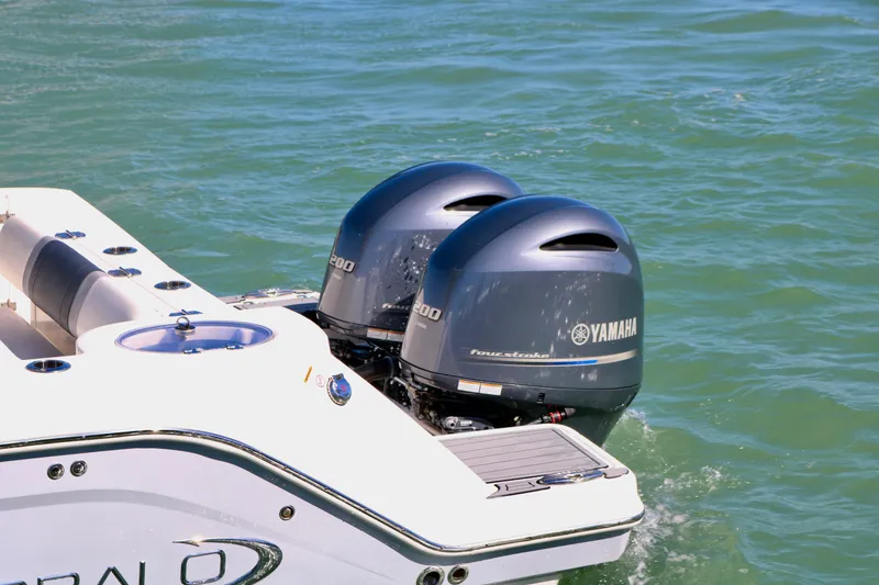 Slide: The Image of 2020 Robalo R272 Center Console with twin Yamaha outboard engines on water. - 5