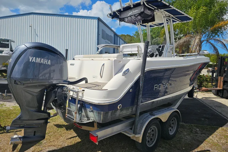 Slide: The Image of 2015 Robalo R222 Center Console boat interior with steering console and seating. - 11