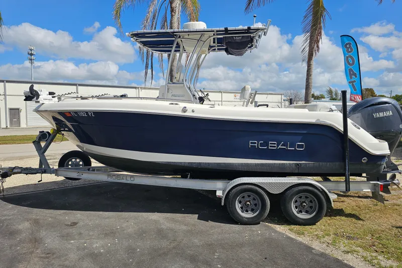 Slide: The Image of 2015 Robalo R222 Center Console boat interior with seating and steering wheel. - 15