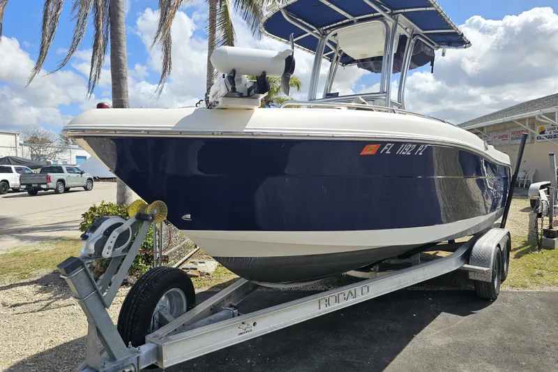 Slide: The Image of Minn Kota Riptide trolling motor on 2015 Robalo R222 Center Console boat. - 17