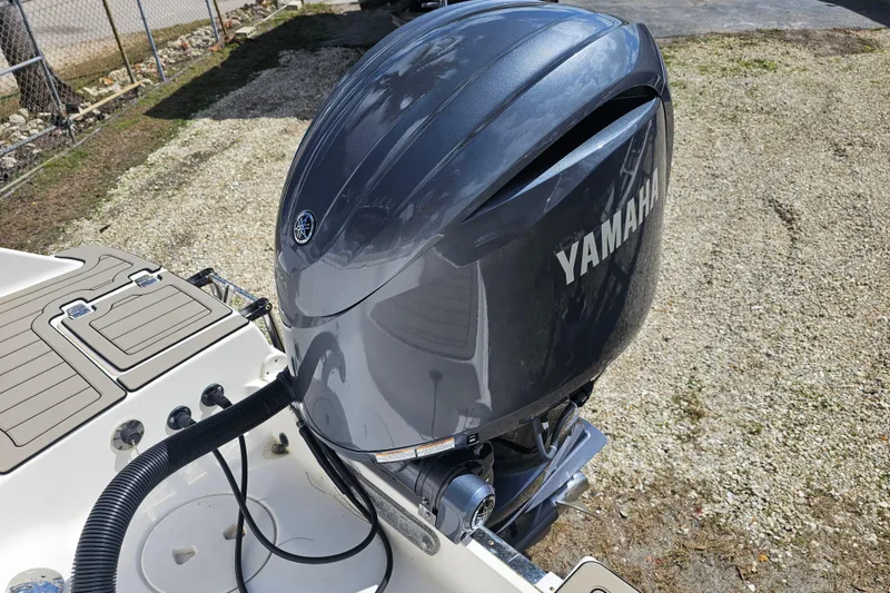 Slide: The Image of 2015 Robalo R222 Center Console storage area with battery and safety equipment. - 20