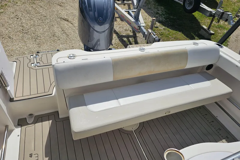 Slide: The Image of 2015 Robalo R222 Center Console boat's open storage compartment with electrical components. - 25