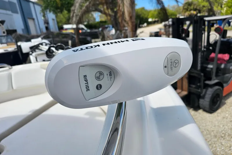 Slide: The Image of 2015 Robalo R222 Center Console boat interior with seating and Yamaha engine. - 28