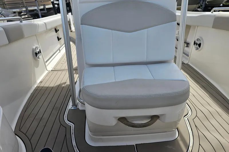 Slide: The Image of 2015 Robalo R222 Center Console boat's open storage compartment with electrical components. - 29
