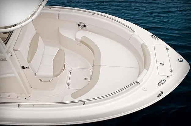 Slide: The Image of 2015 Robalo R222 Center Console boat on trailer, parked outdoors under clear sky. - 3