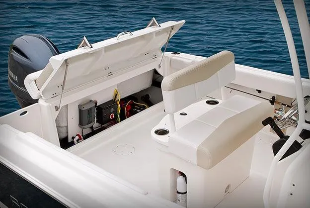 Slide: The Image of 2015 Robalo R222 Center Console boat with Yamaha 200 engine, parked outdoors. - 6