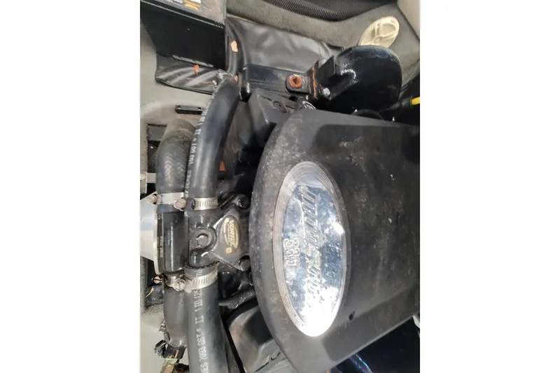 Slide: The Image of 2003 Malibu Sunsetter LXi engine close-up with visible hoses and components. - 15