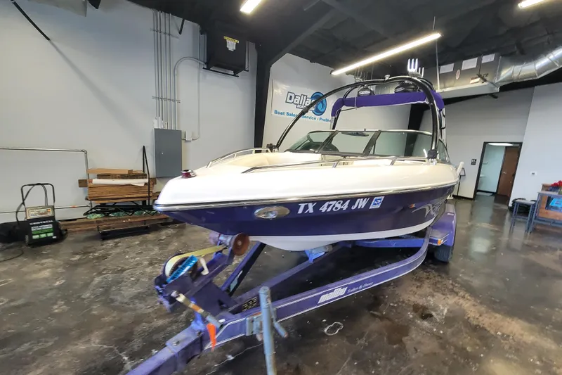 Slide: The Image of 2003 Malibu Sunsetter LXi boat on trailer in indoor showroom. - 6