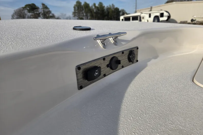 Slide: The Image of 2026 Carolina Skiff 178 JLS boat detail with control panel and cleat. - 13