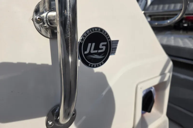 Slide: The Image of 2026 Carolina Skiff 178 JLS boat emblem and handle detail. - 14
