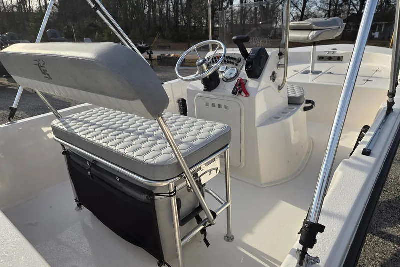 Slide: The Image of 2026 Carolina Skiff 178 JLS boat interior with steering console and seating. - 16