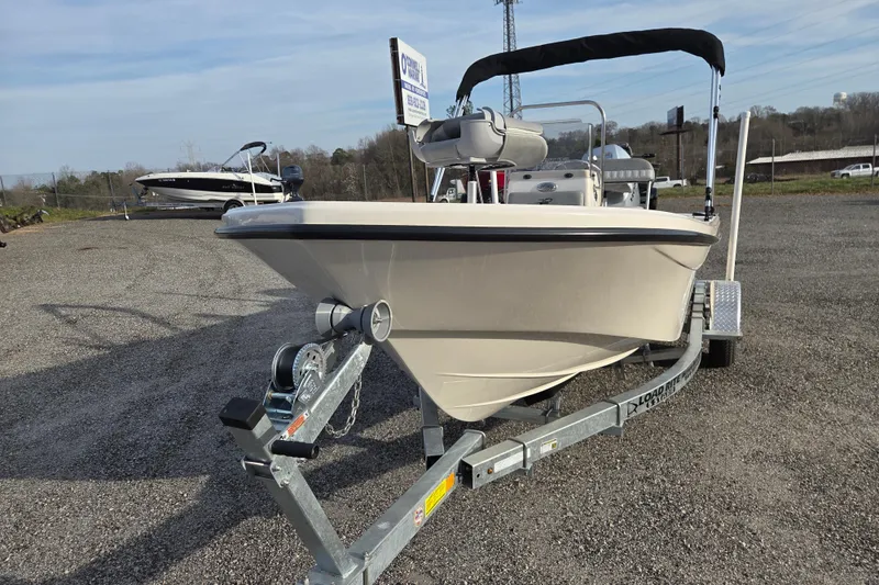 Slide: The Image of 2026 Carolina Skiff 178 JLS boat on trailer in outdoor setting. - 2