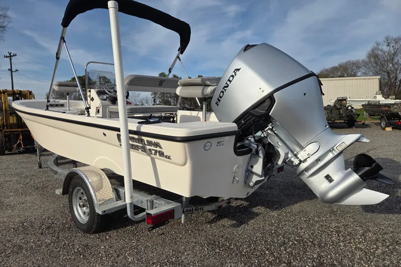 Slide: The Image of 2026 Carolina Skiff 178 JLS boat with Honda outboard motor on trailer. - 4