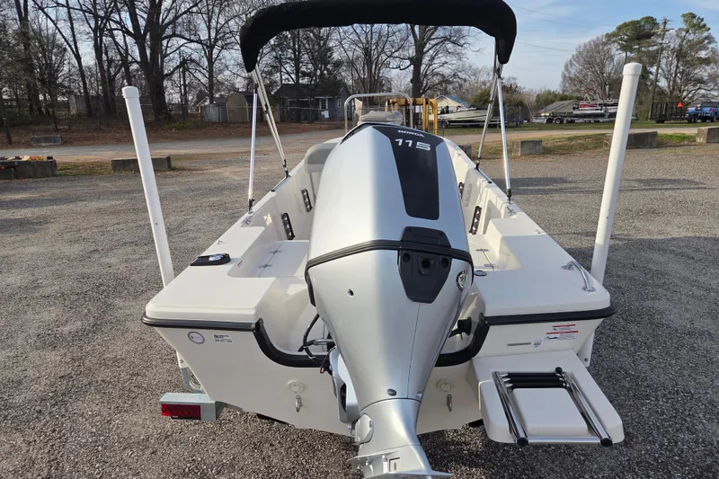 Slide: The Image of 2026 Carolina Skiff 178 JLS boat with Honda 115 outboard motor, parked outdoors. - 5