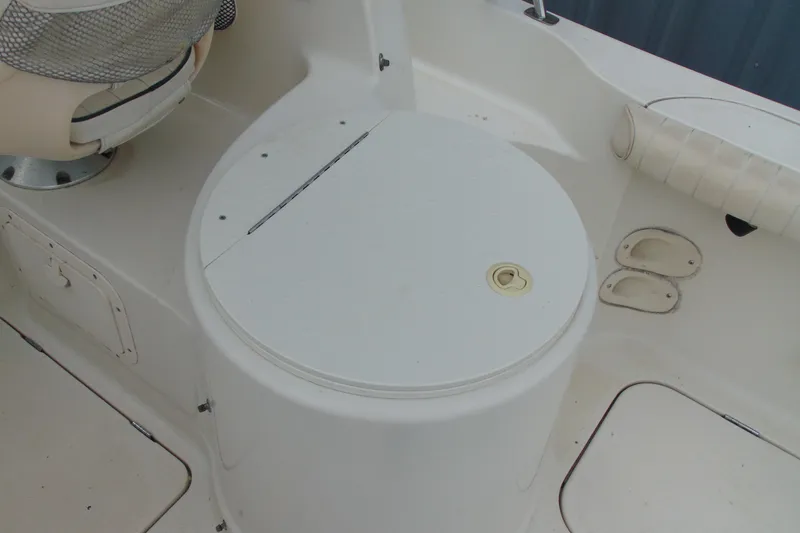 Slide: The Image of 2000 Bayliner 2302 Trophy Walkaround DX/LX boat interior with storage compartment. - 12