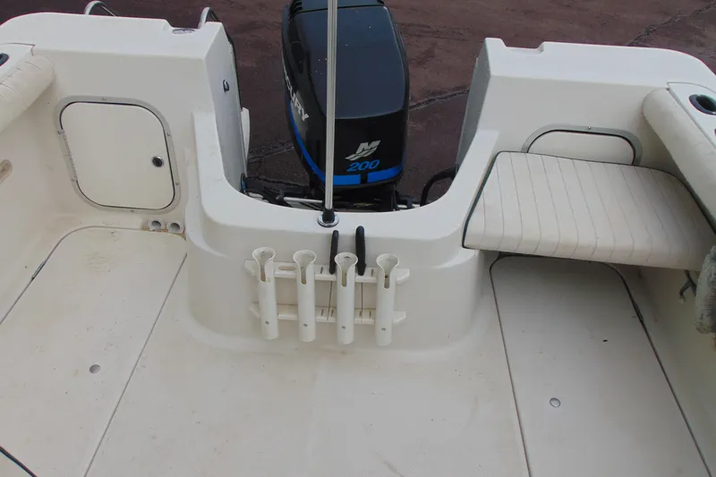 Slide: The Image of Bayliner 2302 Trophy Walkaround DX/LX 2000 boat interior with Mercury 200 engine. - 13