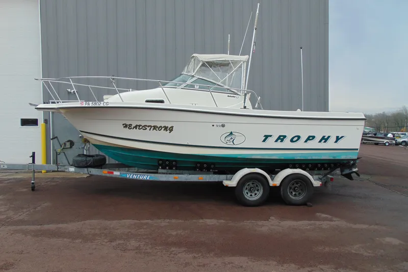 Slide: The Image of 2000 Bayliner 2302 Trophy Walkaround DX/LX boat on trailer, side view. - 2