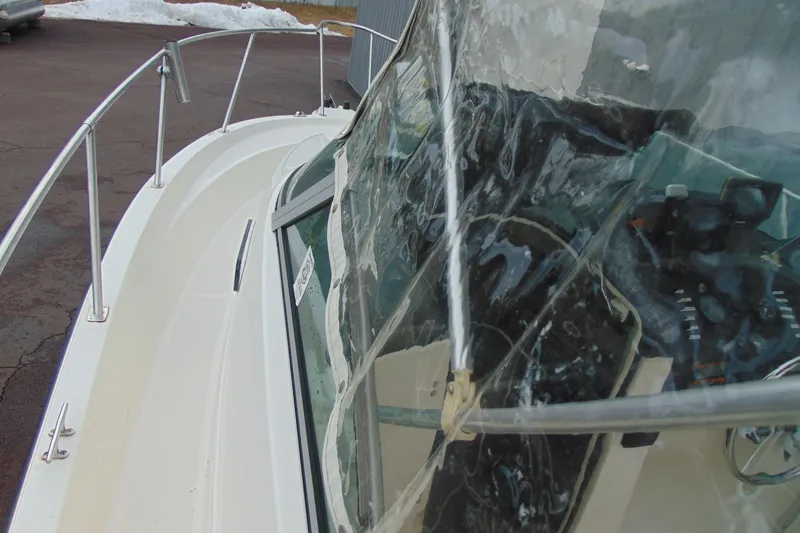 Slide: The Image of 2000 Bayliner 2302 Trophy Walkaround DX/LX boat with windshield and railing detail. - 21