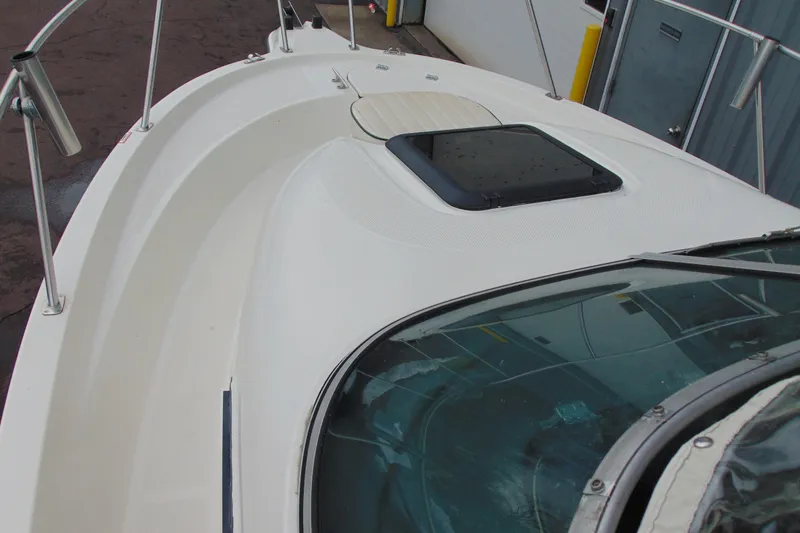 Slide: The Image of 2000 Bayliner 2302 Trophy Walkaround DX/LX boat deck with hatch and railing. - 22