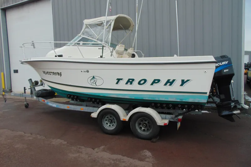 Slide: The Image of 2000 Bayliner 2302 Trophy Walkaround DX/LX boat on trailer, side view. - 3