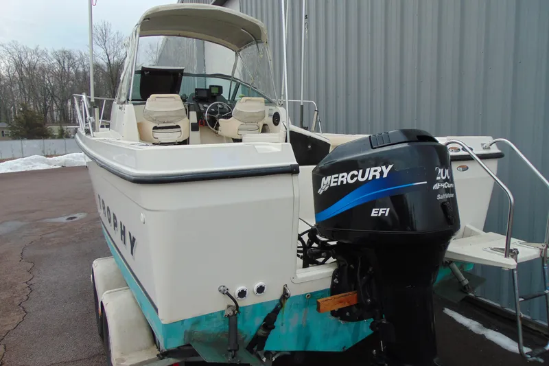 Slide: The Image of 2000 Bayliner 2302 Trophy Walkaround boat with Mercury 200 EFI outboard motor. - 4