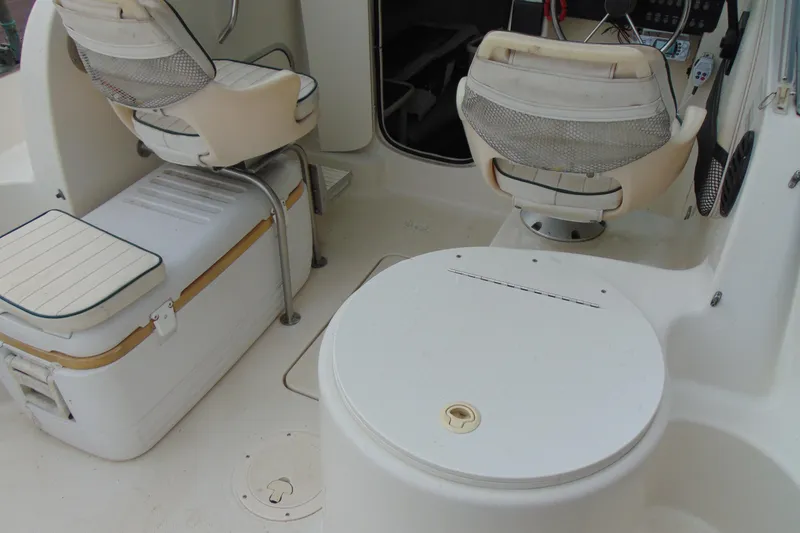 Slide: The Image of 2000 Bayliner 2302 Trophy Walkaround DX/LX boat interior with seating and storage. - 9