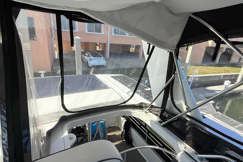 Slide: The Image of Interior view of 1998 Mainship 47 Motor Yacht with marina backdrop. - 18