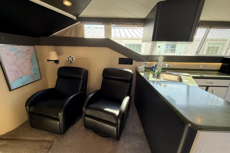 Slide: The Image of Interior of 1998 Mainship 47 Motor Yacht with recliners and kitchenette. - 31